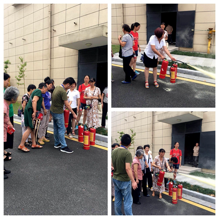 志愿者学习如何正确使用灭火器_副本.jpg 志愿者学习如何正确使用灭火器_副本.jpg